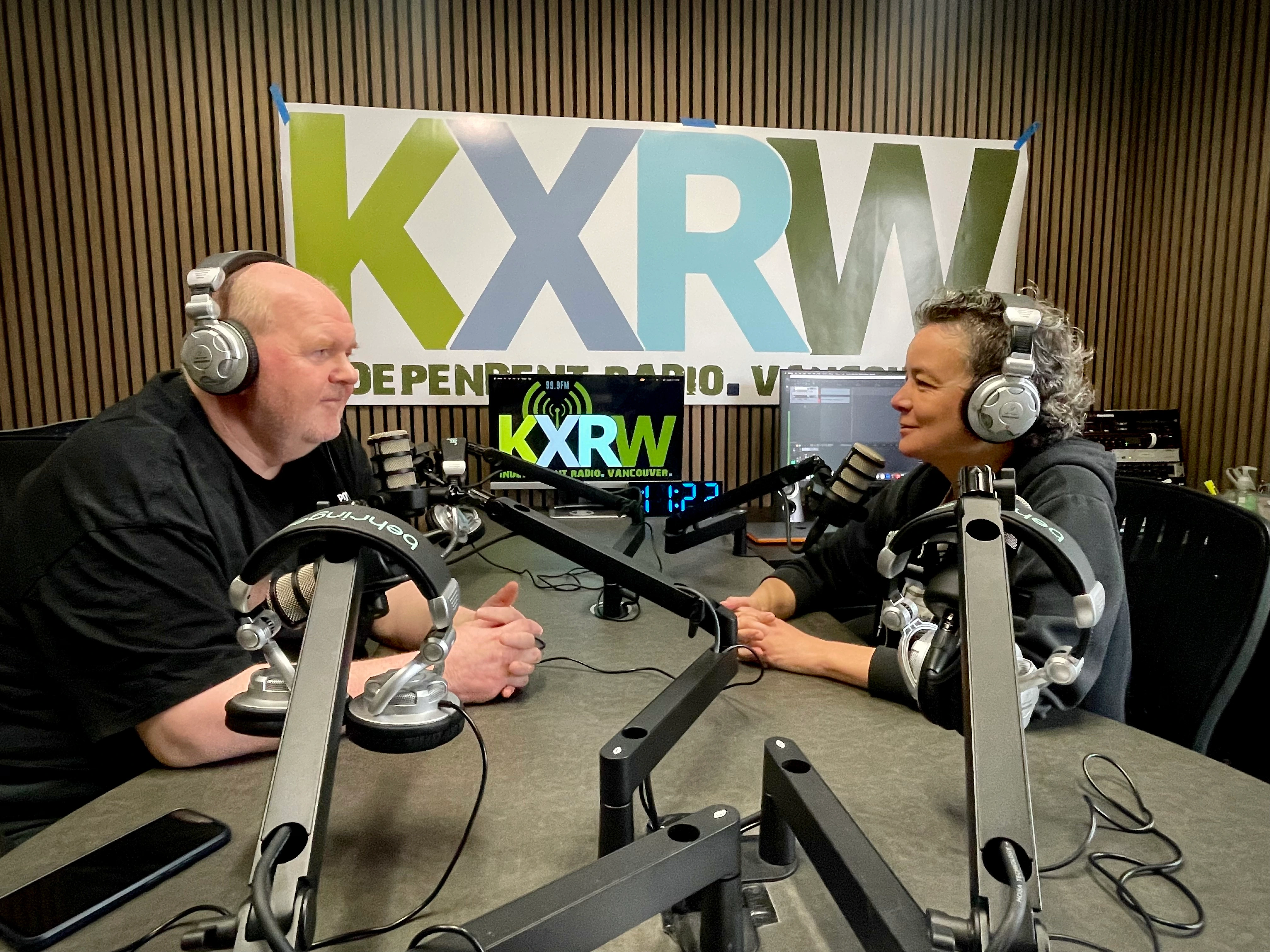 Steena Trecha interviews a longtime Pacific Northwest community radio broadcaster at KXRW studio, Vancouver WA, April 2026